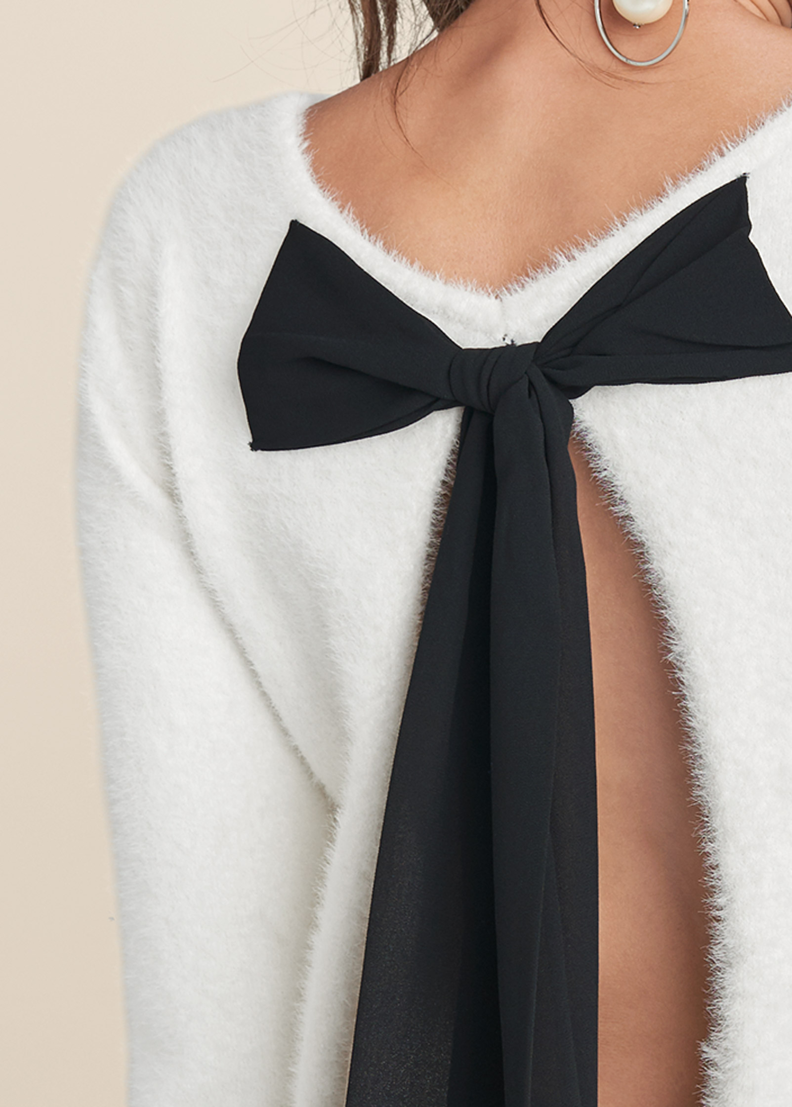 Sweater with bows down the clearance back